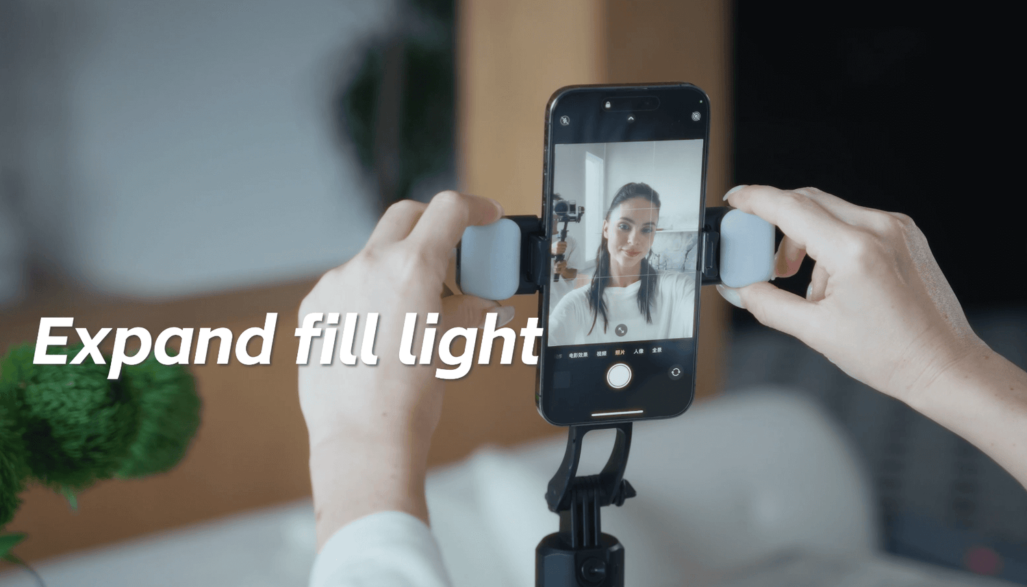 Smartphone on a tripod with fill light, showcasing hands-free filming for content creators.